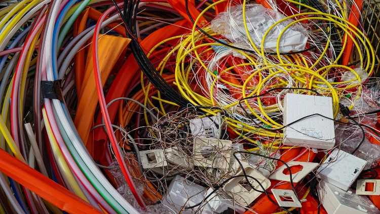 Data center waste showing different colored cables.